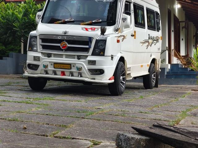 13 seater Tempo Traveller – front three-quarter view