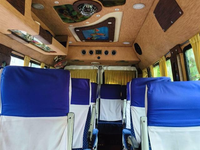 13 seater Tempo Traveller interior – pushback seats and designer ceiling