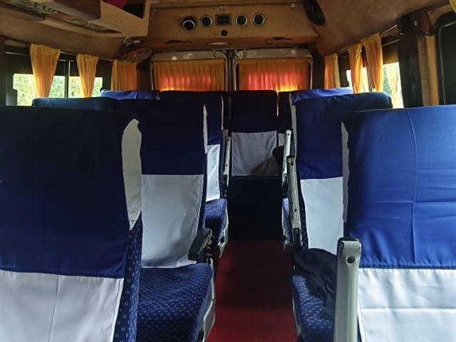 13 seater Tempo Traveller interior – aisle view