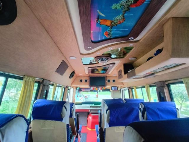 13 seater Tempo Traveller interior – LED ceiling panels and seating